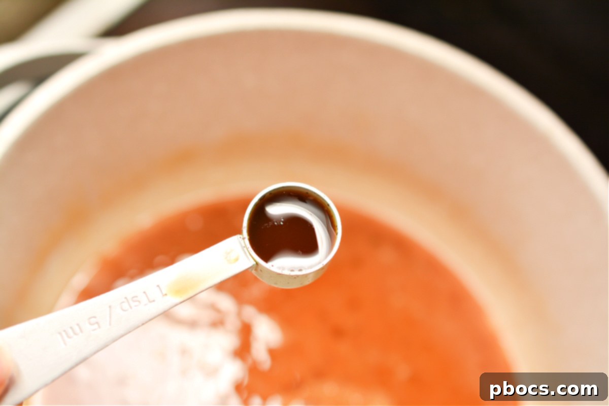 Adding vanilla extract to the praline mixture