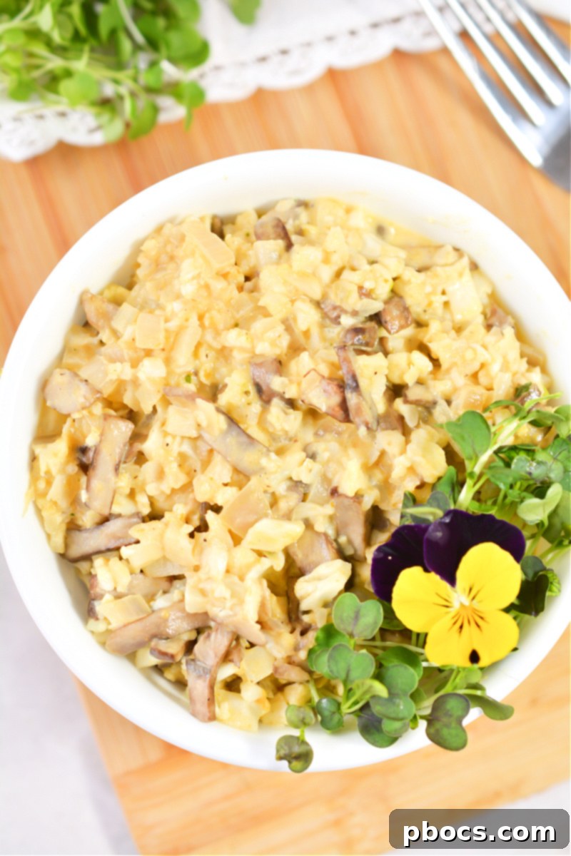 Adding pumpkin puree and cream to the Keto Mushroom and Pumpkin Risotto