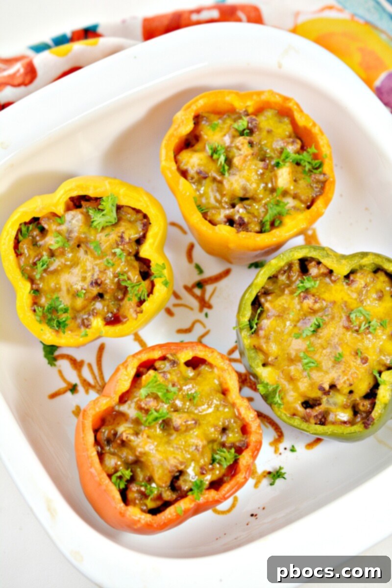 Keto Sloppy Joe Bell Pepper Boats 2 Keto Sloppy Joe Stuffed Peppers with melted cheese, ready to serve
