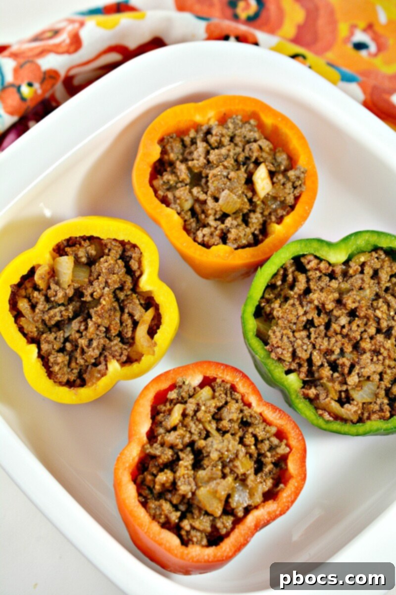 Keto Sloppy Joe Bell Pepper Boats 13 Topping stuffed bell peppers with shredded cheddar cheese