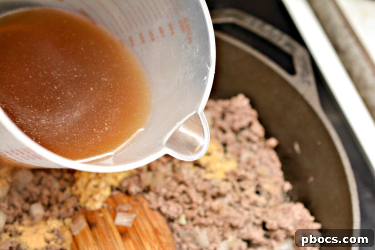 Keto Sloppy Joe Bell Pepper Boats 10 Adding spices and liquids to the ground beef and onion mixture