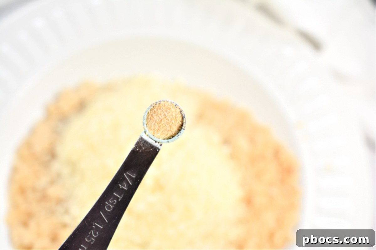 Keto Cordon Bleu Chicken Poppers 11 Close-up of the breading mixture ready for coating.