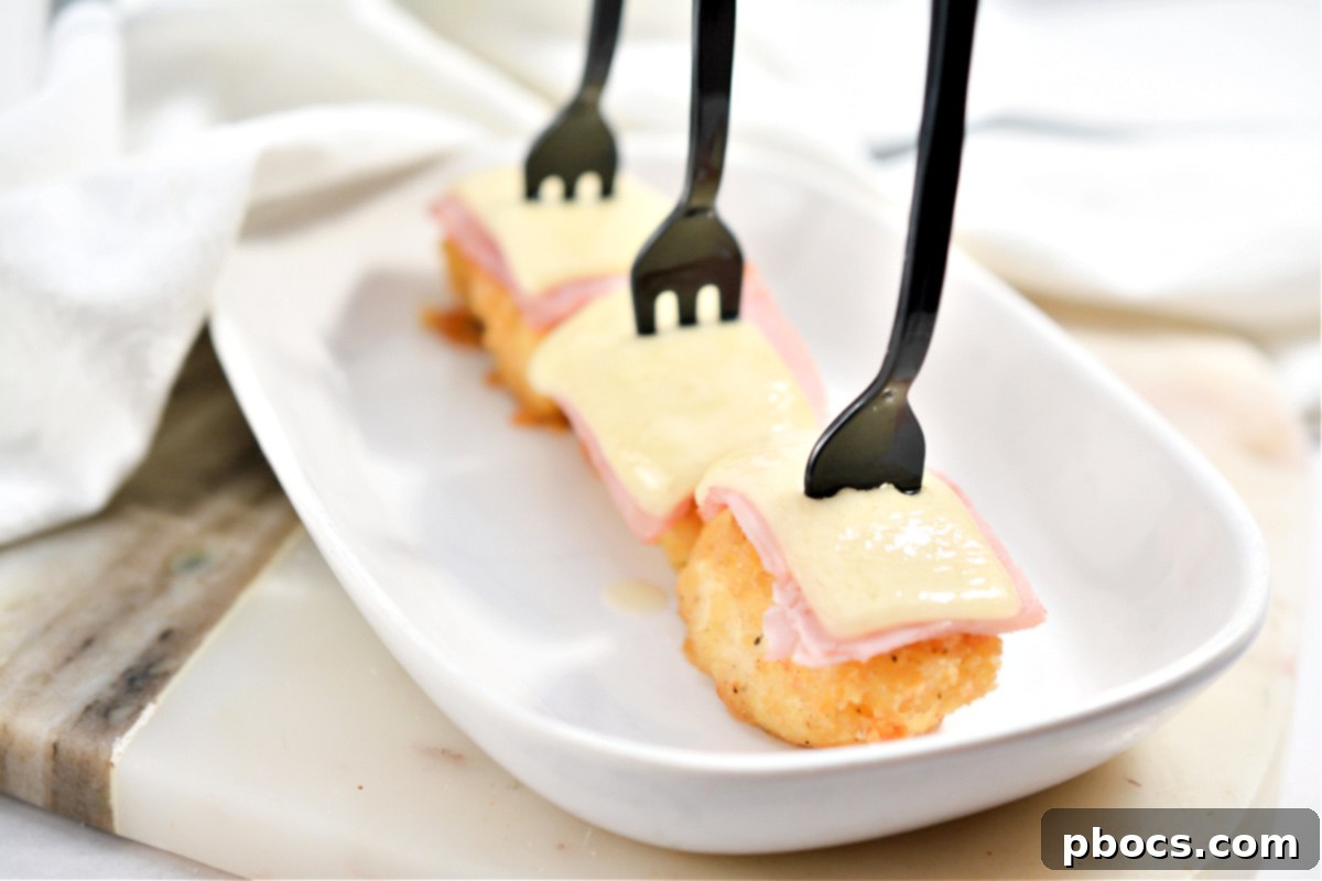 Keto Cordon Bleu Chicken Poppers 9 Keto Chicken Cordon Bleu Bites in a baking dish, fresh out of the oven with melted cheese.