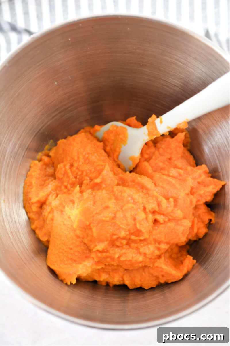 Mixing ingredients for the pumpkin base of Keto Pumpkin Pecan Dump Cake