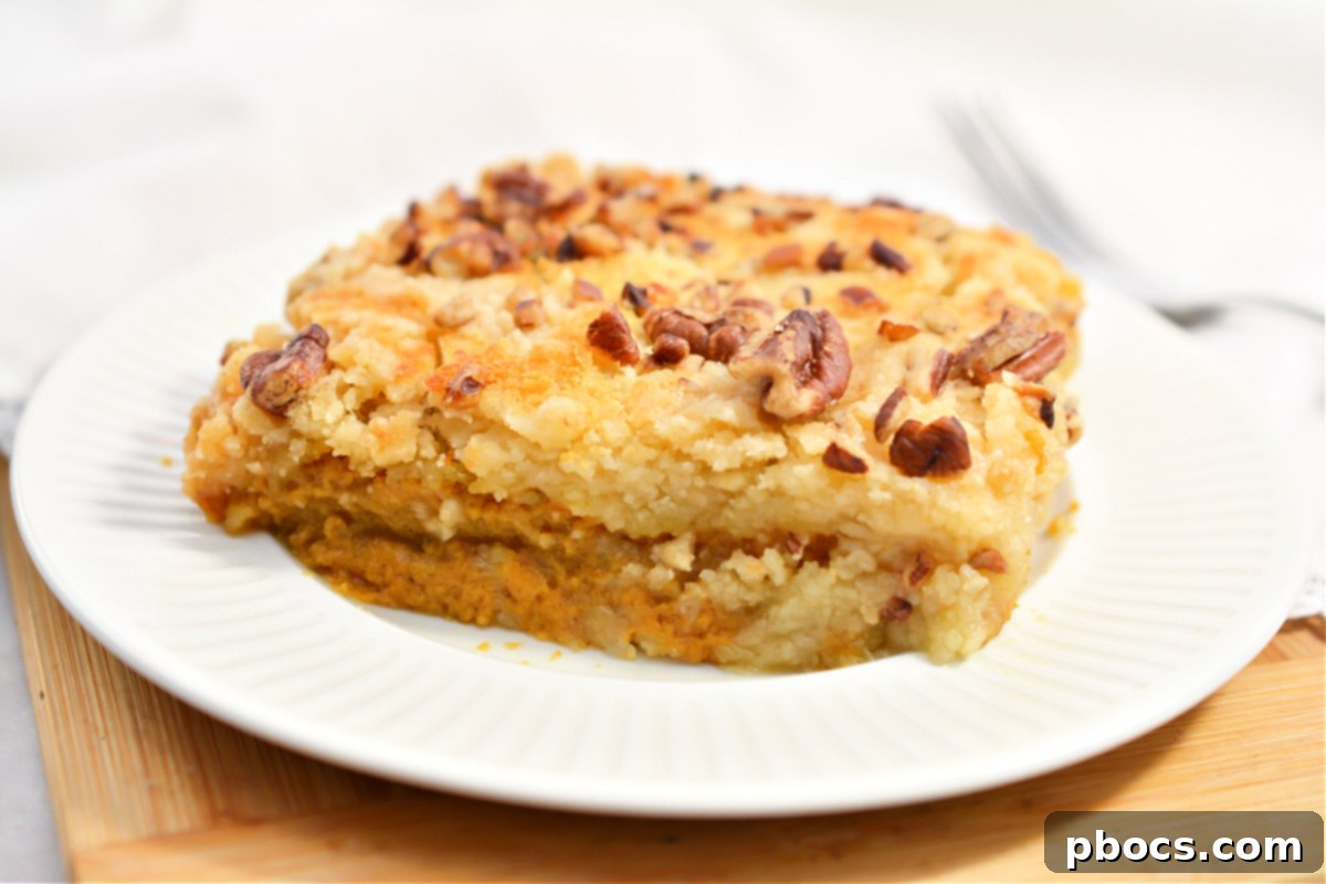 Close-up of the gooey texture of Keto Pumpkin Pecan Dump Cake