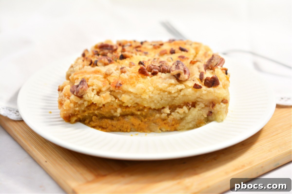 Two distinct layers of Keto Pumpkin Pecan Dump Cake: pumpkin base and pecan crumble