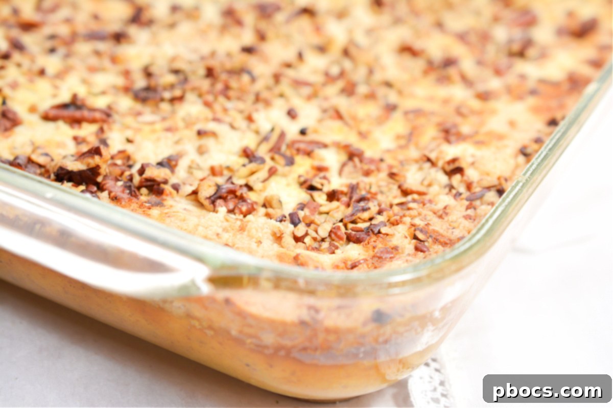 Keto Pumpkin Pecan Dump Cake with a sprinkle of pumpkin pie spice