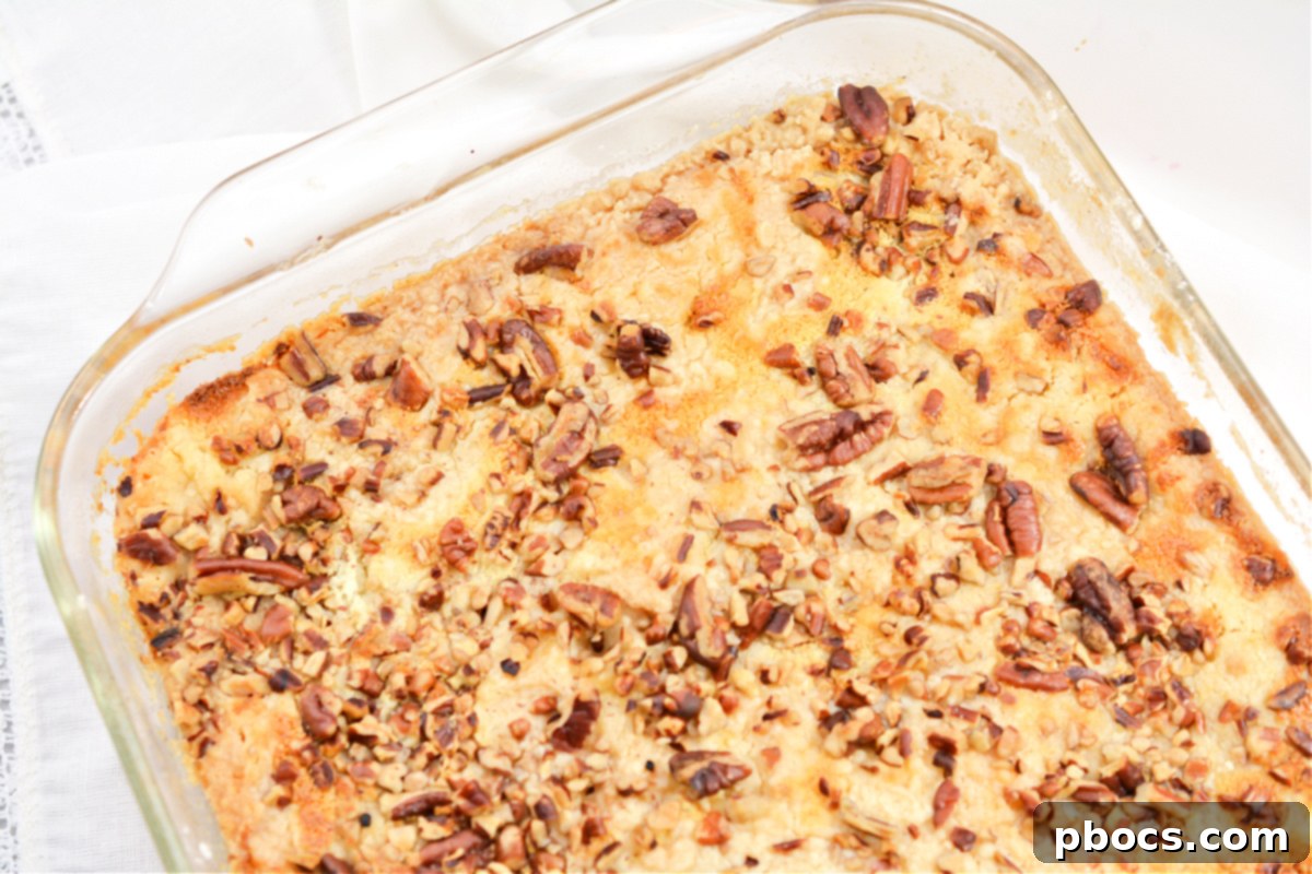 Adding pecan crumble topping to Keto Pumpkin Pecan Dump Cake