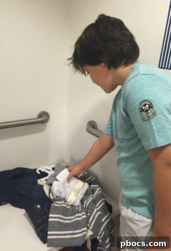 Stylish Back to School Outfits 25% Off OshKosh B'Gosh 3 A boy looking at stylish back to school outfits inside an OshKosh B'Gosh store