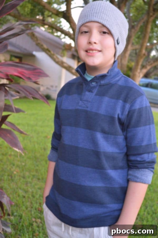 Stylish Back to School Outfits 25% Off OshKosh B'Gosh 5 Another view of the boy in his sweater, tee, shorts, and beanie outfit from OshKosh B'Gosh