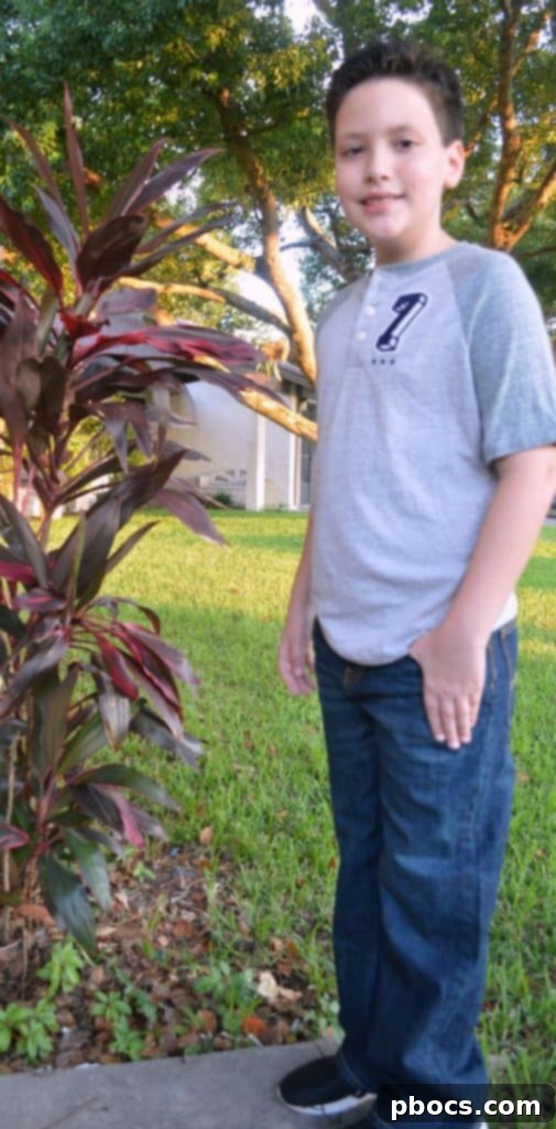 Stylish Back to School Outfits 25% Off OshKosh B'Gosh 7 Full length view of a boy showcasing stylish back to school jeans and varsity tee