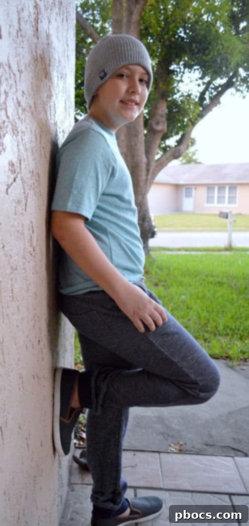 Stylish Back to School Outfits 25% Off OshKosh B'Gosh 8 A boy rocking stylish back to school joggers, a simple tee, and a beanie for an athleisure look