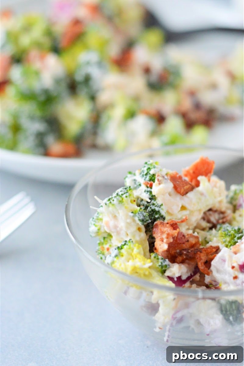 Side view of Low Carb Chicken Broccoli Salad with fresh lemon