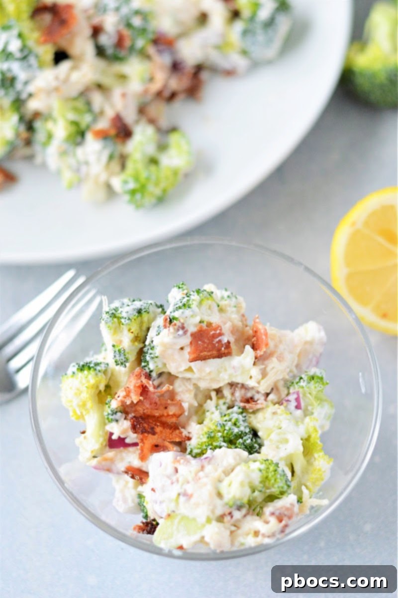Serving of Low Carb Chicken Broccoli Salad garnished with bacon