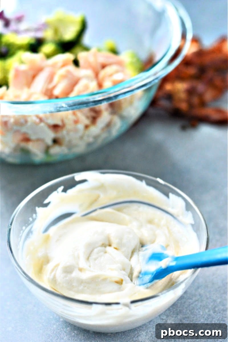 Whisking creamy lemon garlic dressing ingredients