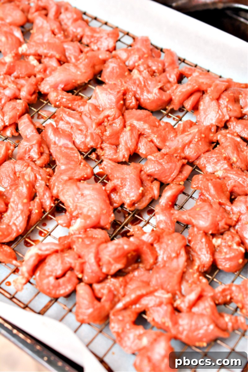 Pork strips layered on a baking rack