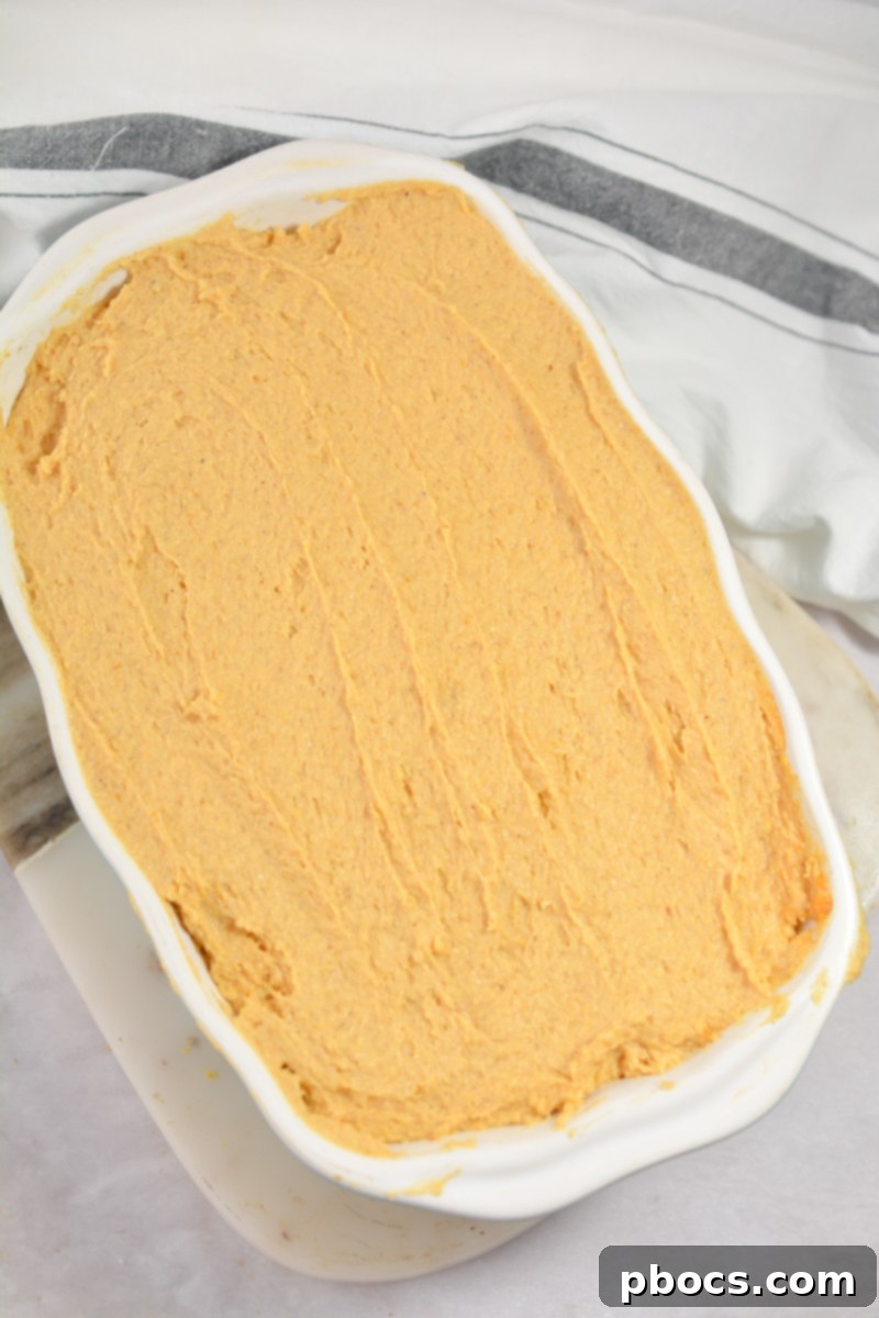 Keto Pumpkin Pound Cake baking in a loaf pan