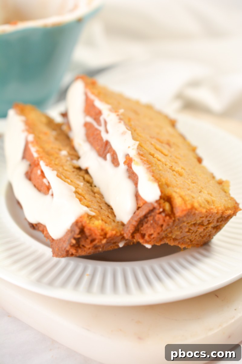 Close-up of a Keto Pumpkin Pound Cake slice with glaze