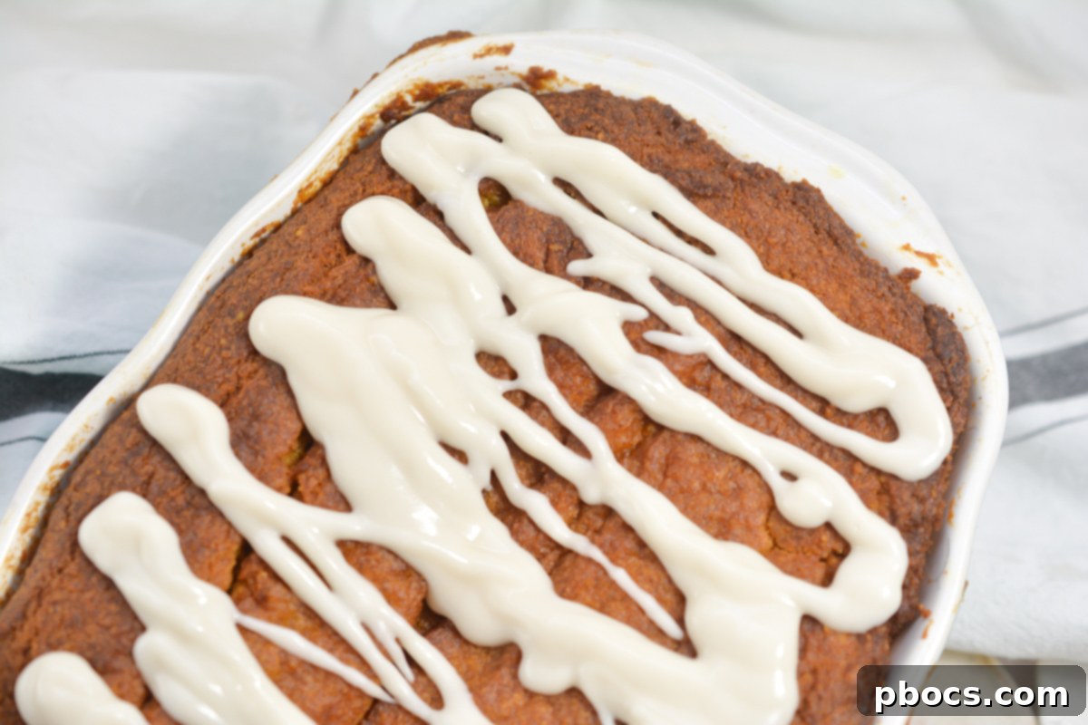Keto Pumpkin Pound Cake with a delicate glaze drizzled over it