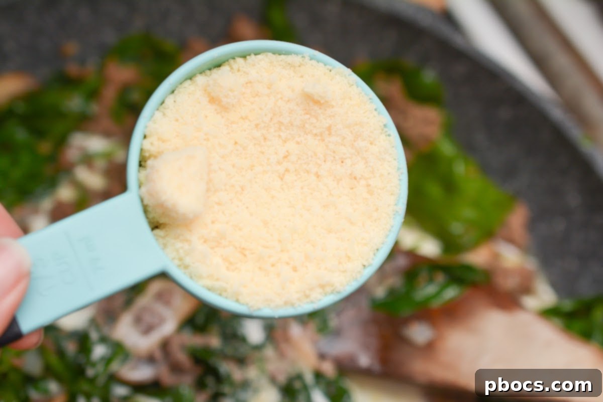 Ultimate Cheesy Keto Beef, Spinach & Mushroom Feast 11 Basil and minced garlic stirred into the beef and mushroom mixture.