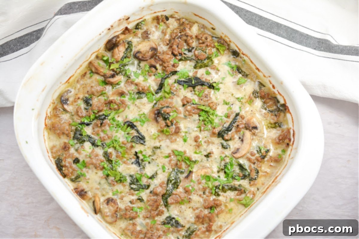 Ultimate Cheesy Keto Beef, Spinach & Mushroom Feast 6 A dish of Cheesy Keto Ground Beef Casserole with Spinach and Mushrooms, ready for meal prep containers.