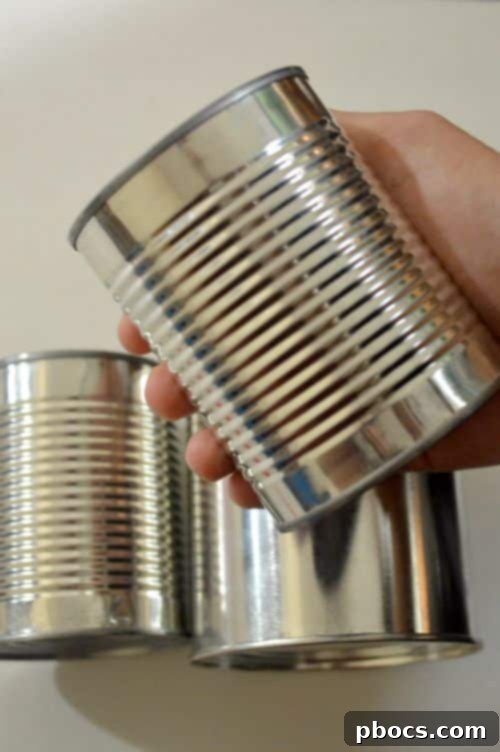 Step 1: Removing labels from empty cans for DIY pen holder