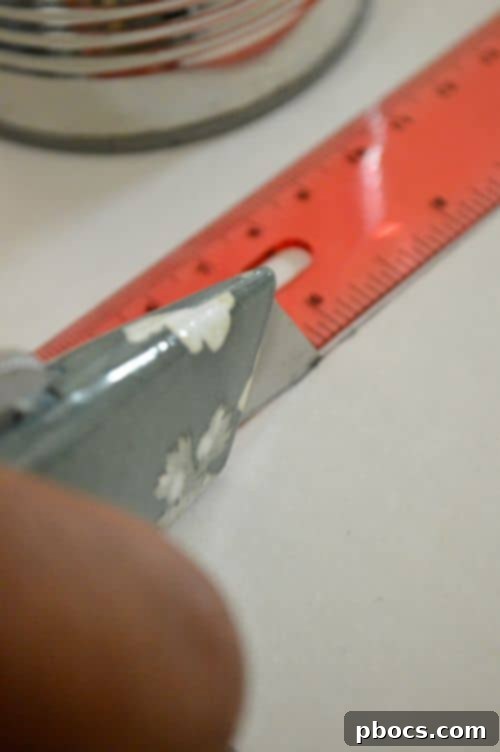 Step 3: Cutting the foam board with a box cutter for the pen organizer base