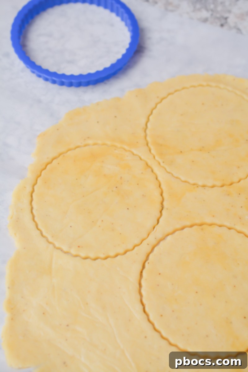 Keto Empanada Delights 14 Rolling Out Keto Empanada Dough Between Parchment Paper