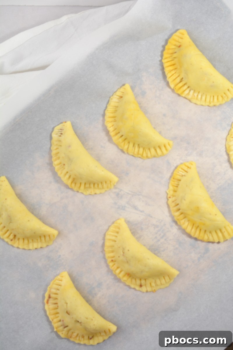 Keto Empanada Delights 15 Assembling and Sealing Keto Empanadas with a Fork