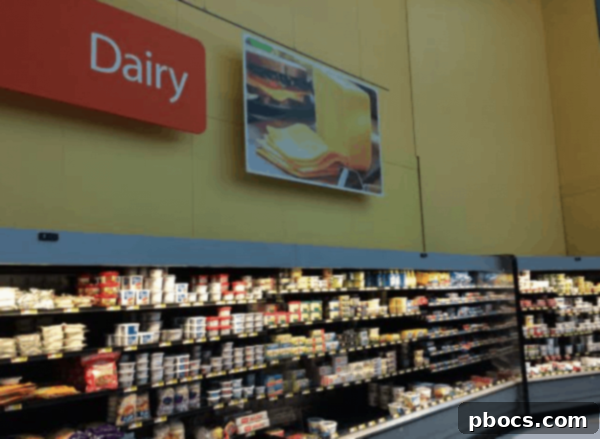 Children painting Hershey's pudding cups orange for pumpkin craft, showing hands and cups