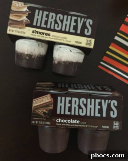 Materials laid out for making DIY Pumpkin Treats with Hershey Pudding Packs