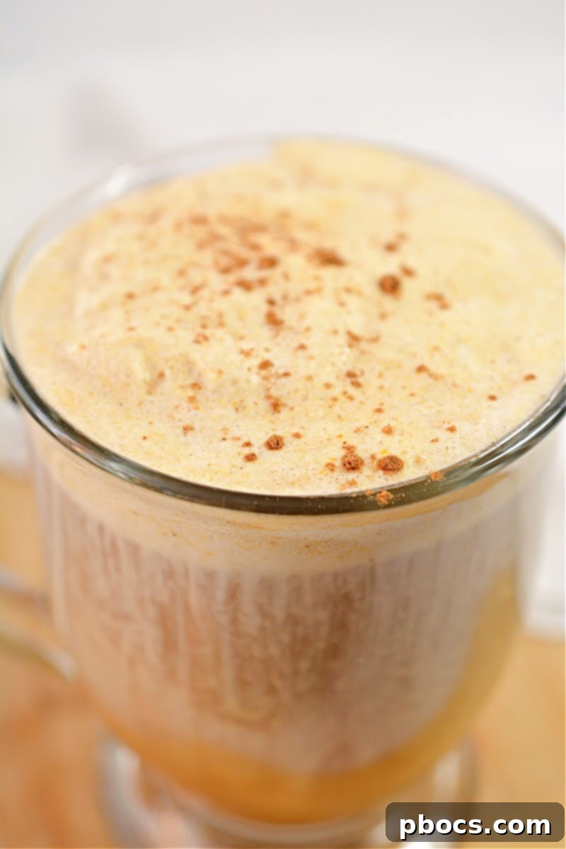 Making the creamy foam for Keto Pumpkin Cold Brew in a bowl.