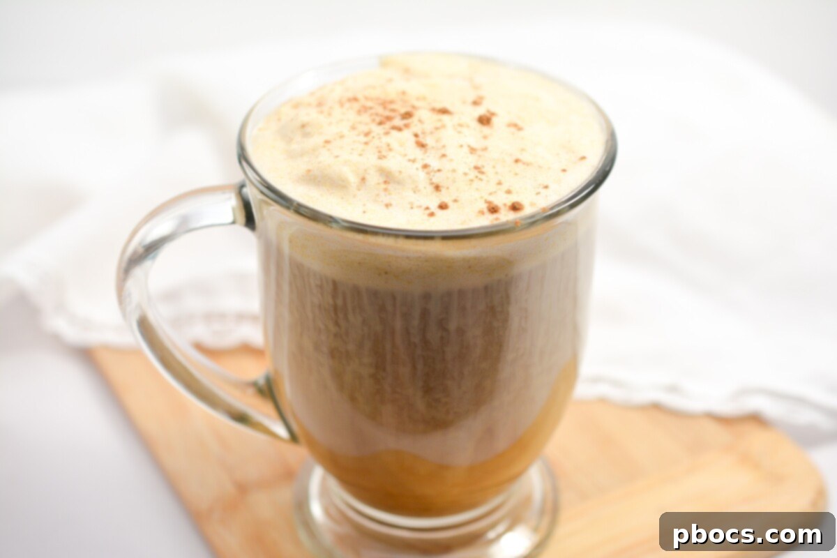 A large mason jar filled with Keto Pumpkin Cold Brew, ready for storage.