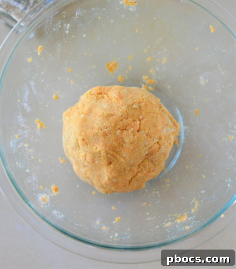 Rolling out dough into breadsticks for Low Carb Everything Bagel Breadsticks With Pumpkin