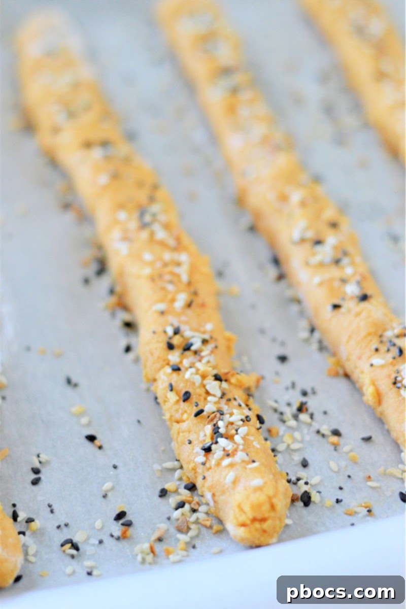 Low Carb Everything Bagel Breadsticks With Pumpkin on baking sheet ready for oven