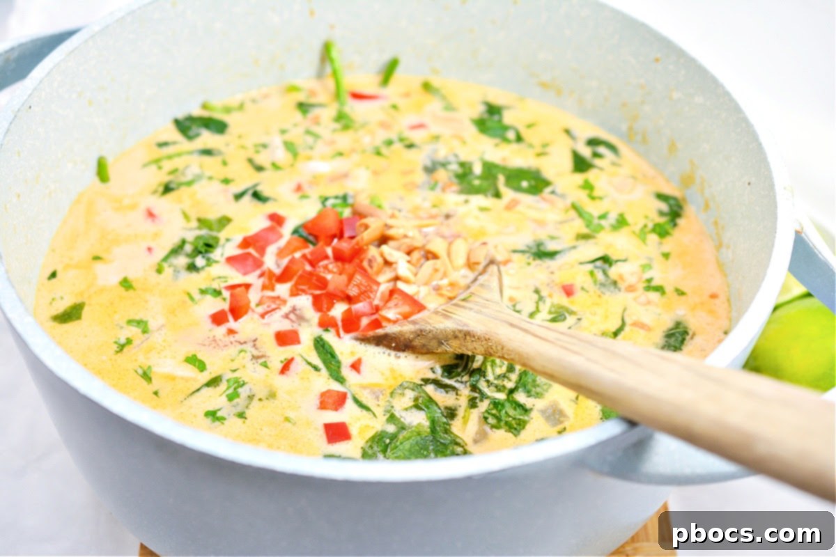 Onions and garlic sautéing in a pan for Creamy Keto Thai Chicken Soup