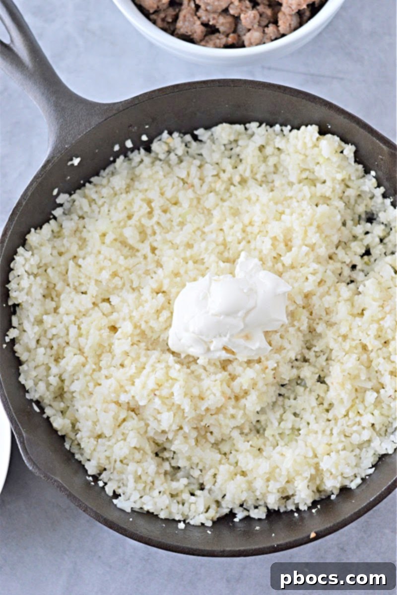 Melting Cream Cheese into Cauliflower Rice