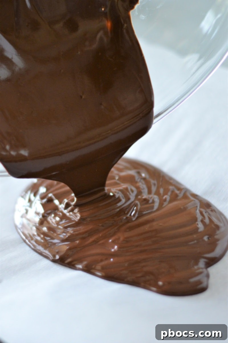 Sugar-Free Almond Pecan Keto Bark 12 Spreading melted chocolate for Keto Chocolate Bark