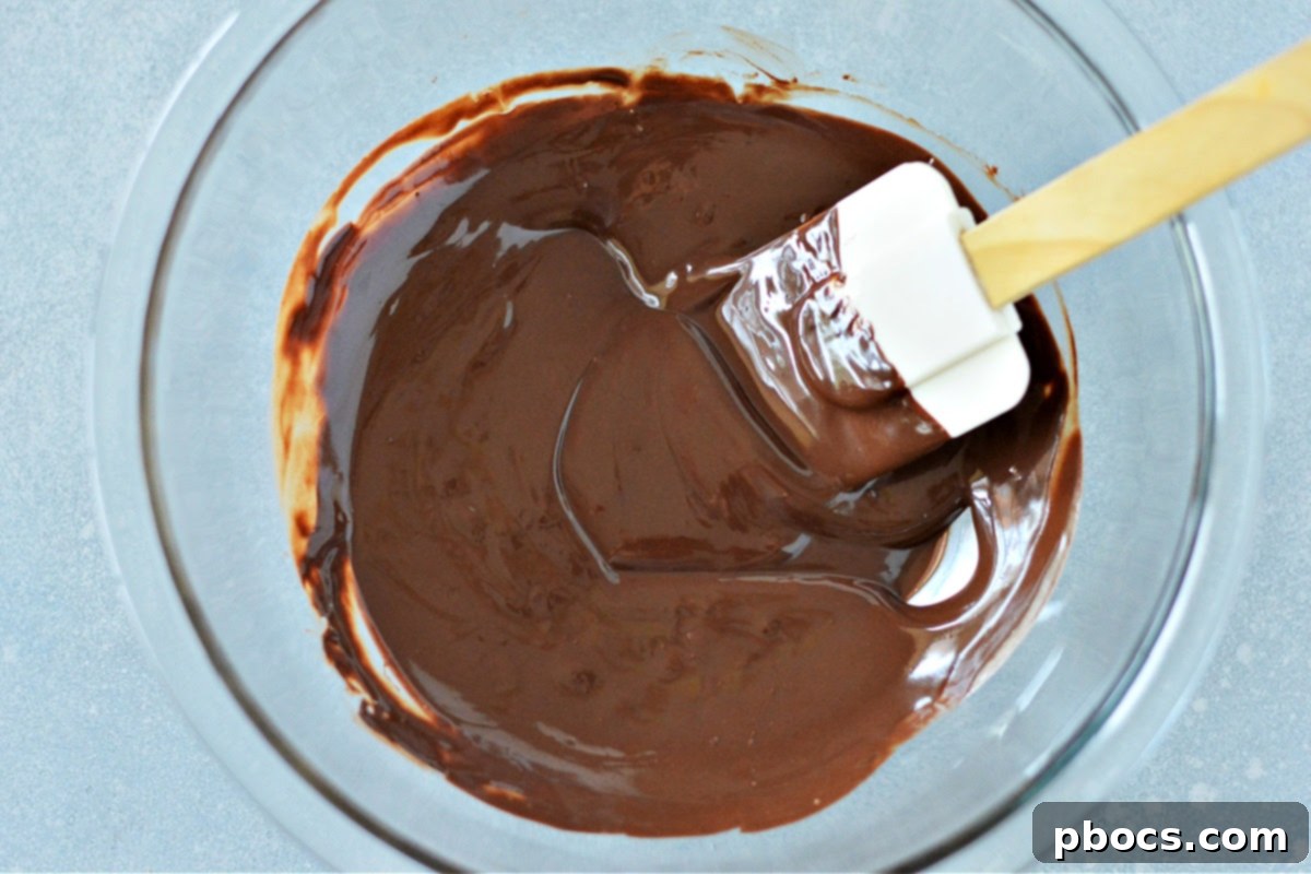 Sugar-Free Almond Pecan Keto Bark 11 Melting chocolate chips with coconut oil for Keto Chocolate Bark