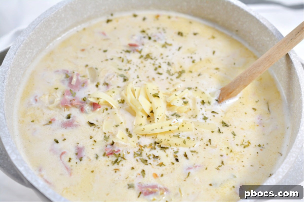 Hearty Keto Reuben Soup 12 Keto Reuben Soup topped with melted Swiss cheese, ready to be served.