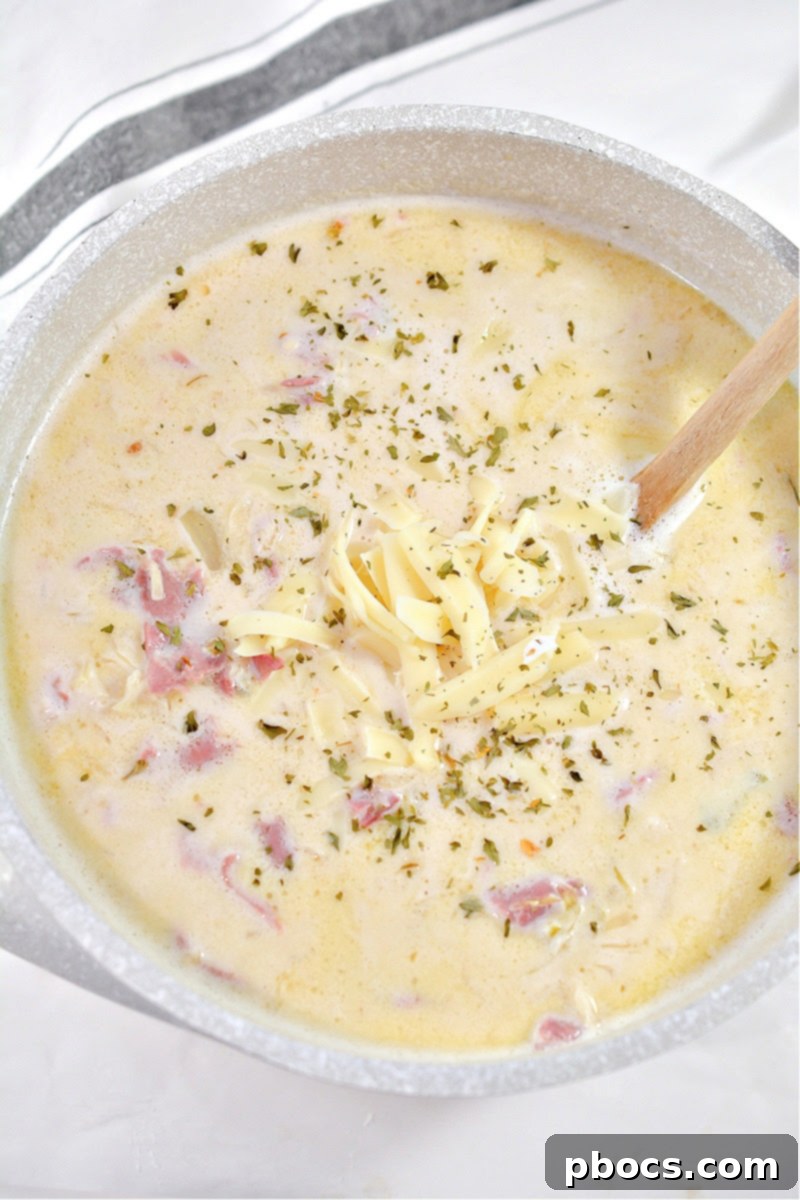 Hearty Keto Reuben Soup 5 Hearty bowl of Low-Carb Reuben Soup, garnished with fresh herbs.