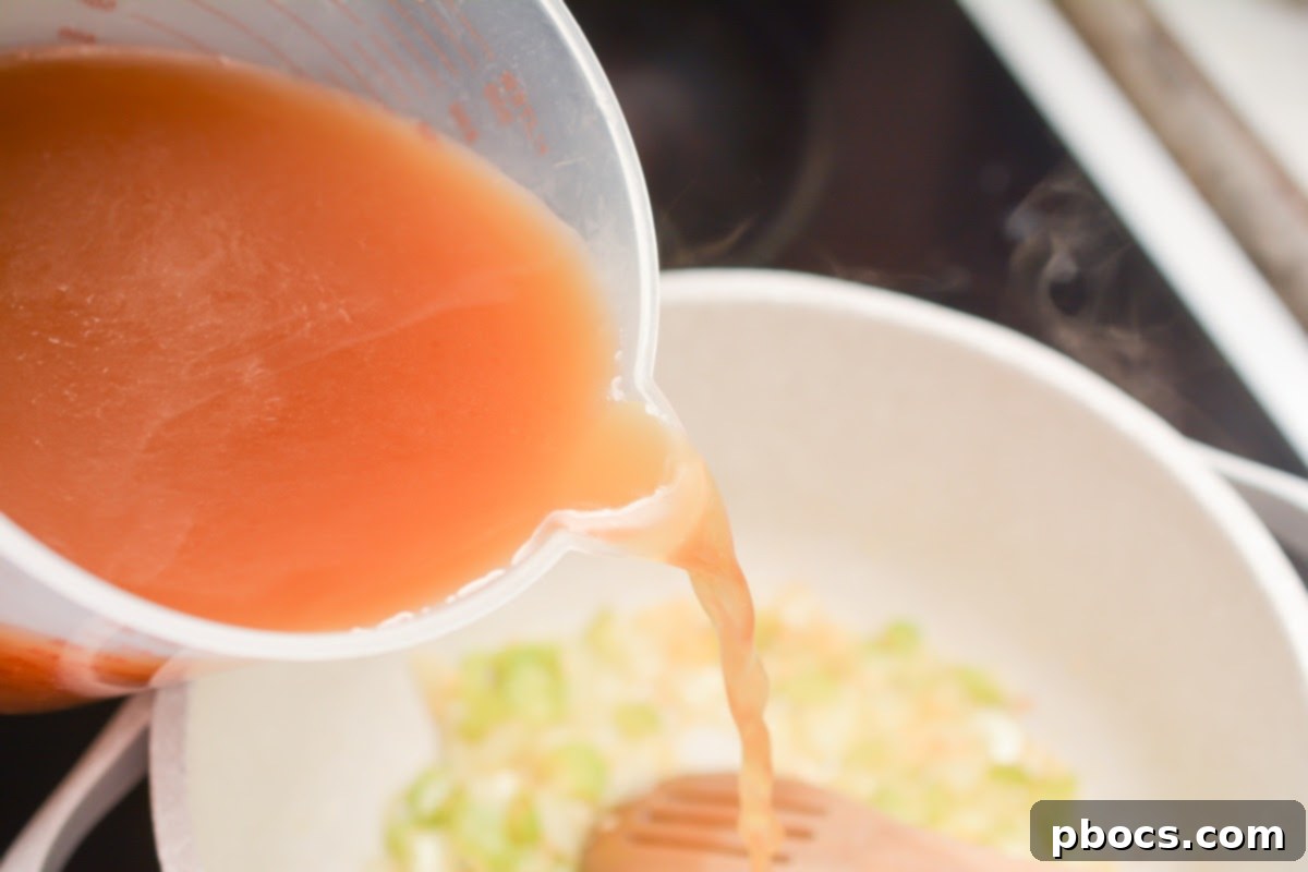 Hearty Keto Reuben Soup 10 Beef broth and heavy cream combined in a pot for creamy Reuben Soup.