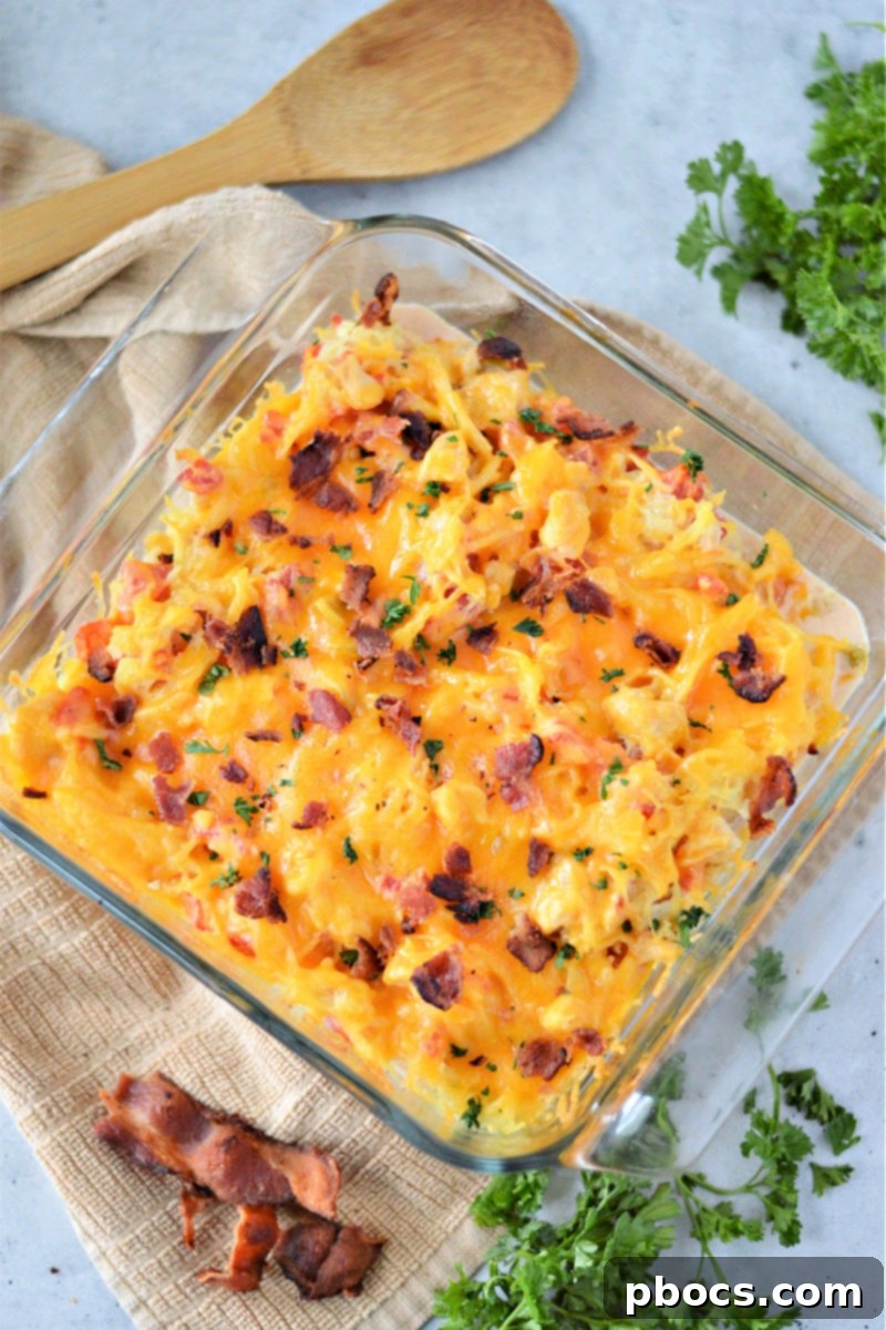 Spaghetti squash strands mixed with creamy sauce for low-carb chicken spaghetti