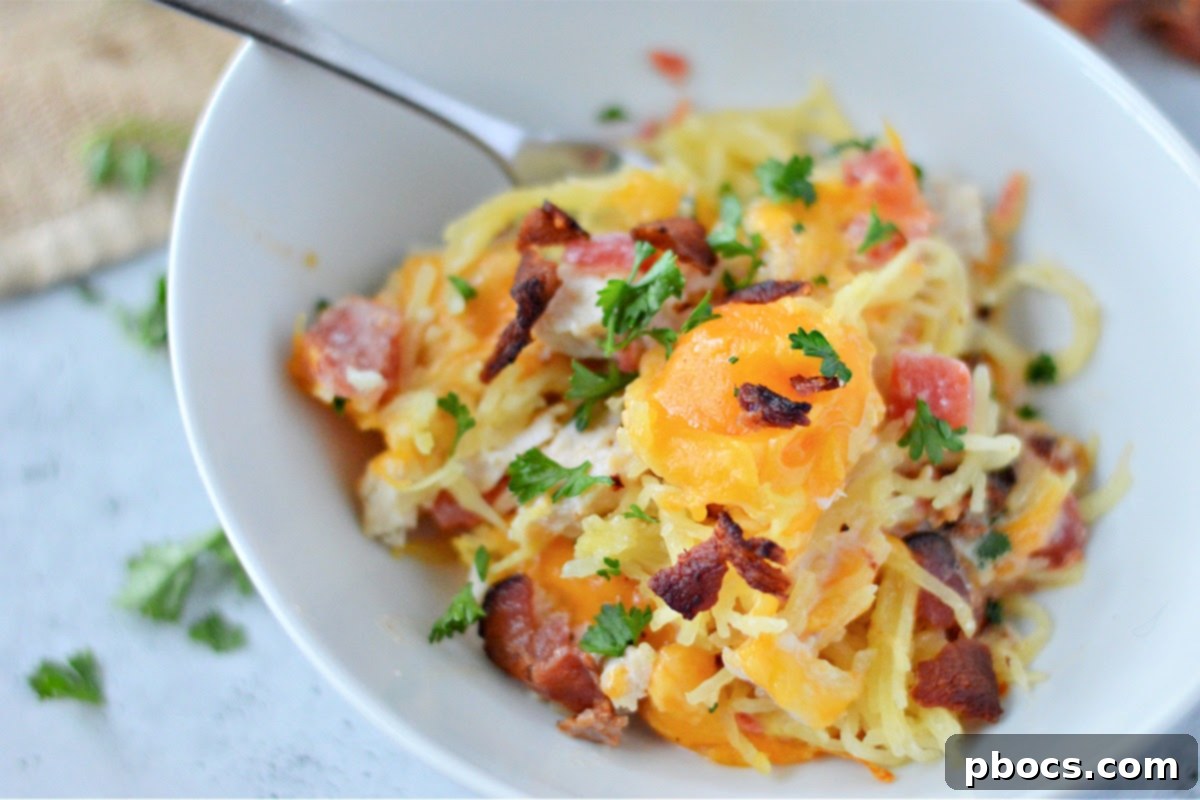 Mixing low-carb cheesy chicken spaghetti ingredients in a bowl