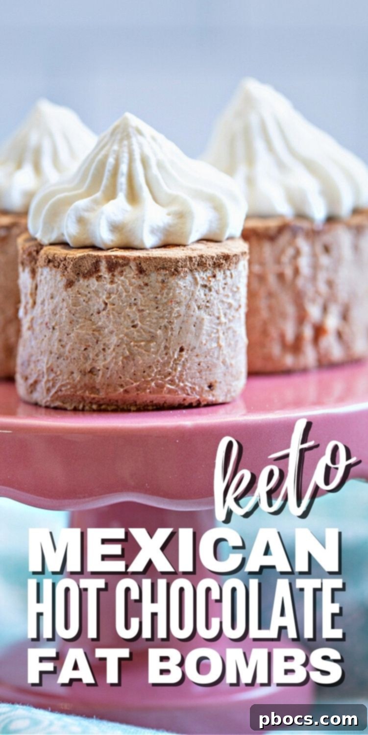 A Pinterest-friendly vertical image of Keto Hot Chocolate Fat Bombs, garnished with whipped cream and cocoa, with text overlays.