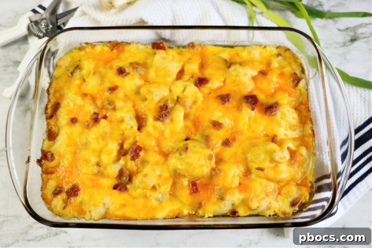 Close-up of golden brown Keto Cauliflower Au Gratin with melted cheese and crispy bacon bits.