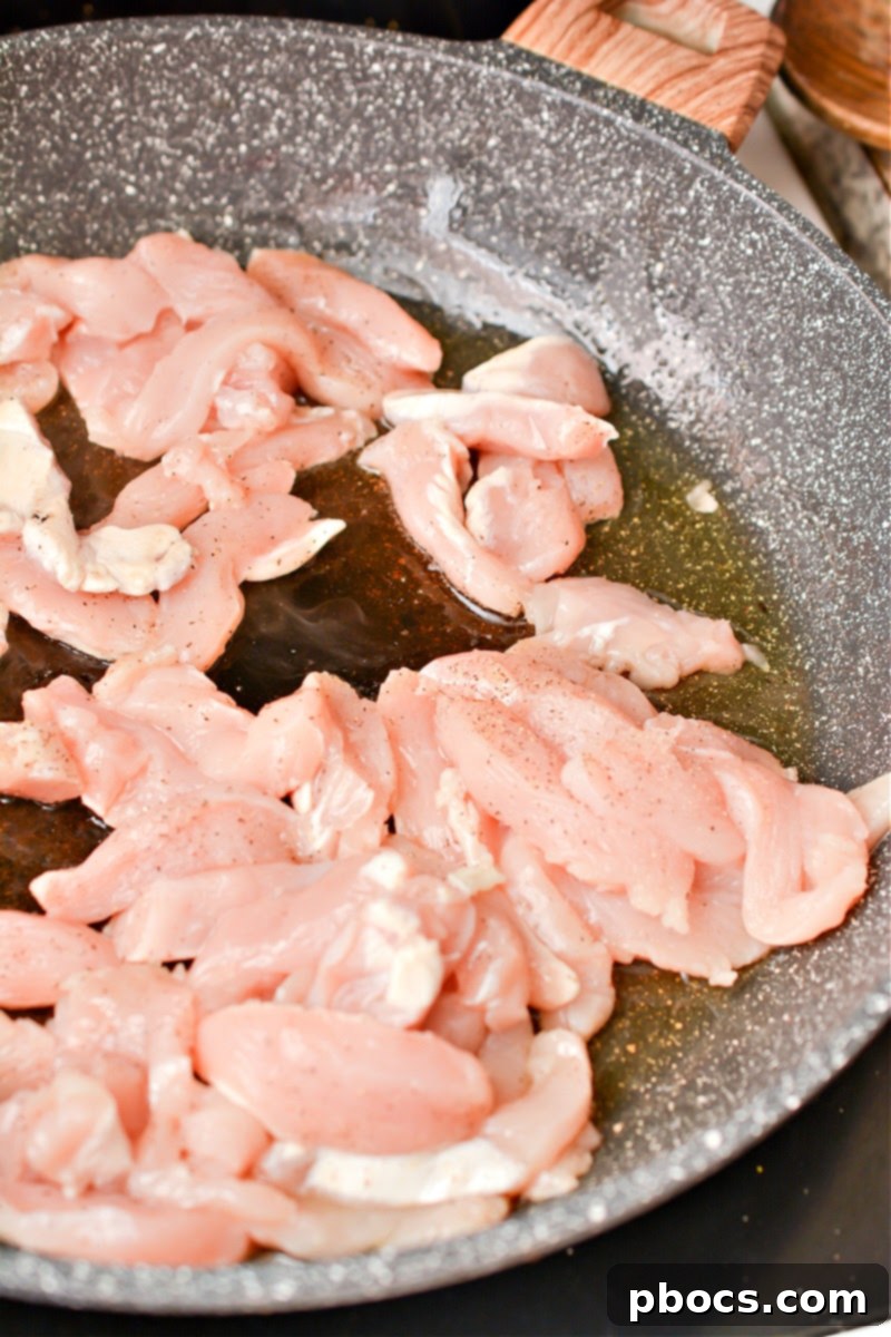 Keto Asian Mushroom Chicken Stir-fry 8 Chicken cooking in a skillet for Keto Asian Chicken