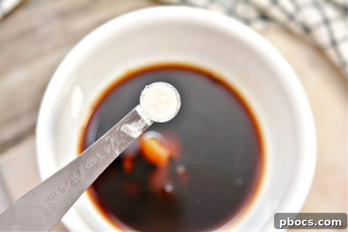 Keto Asian Mushroom Chicken Stir-fry 10 Sauce ingredients being whisked in a bowl for Keto Asian Chicken