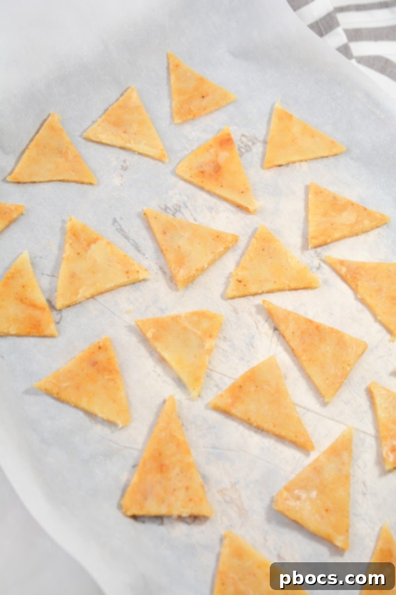 Keto Chili Lime Tortilla Crisps 12 Rolling out keto tortilla dough between parchment paper