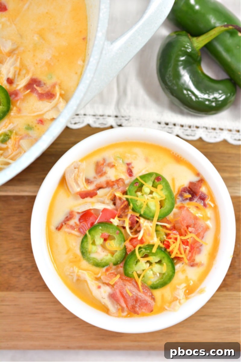 Creamy Keto Jalapeno Popper Soup 4 Overhead shot of Keto Jalapeno Popper Soup simmering in a pot